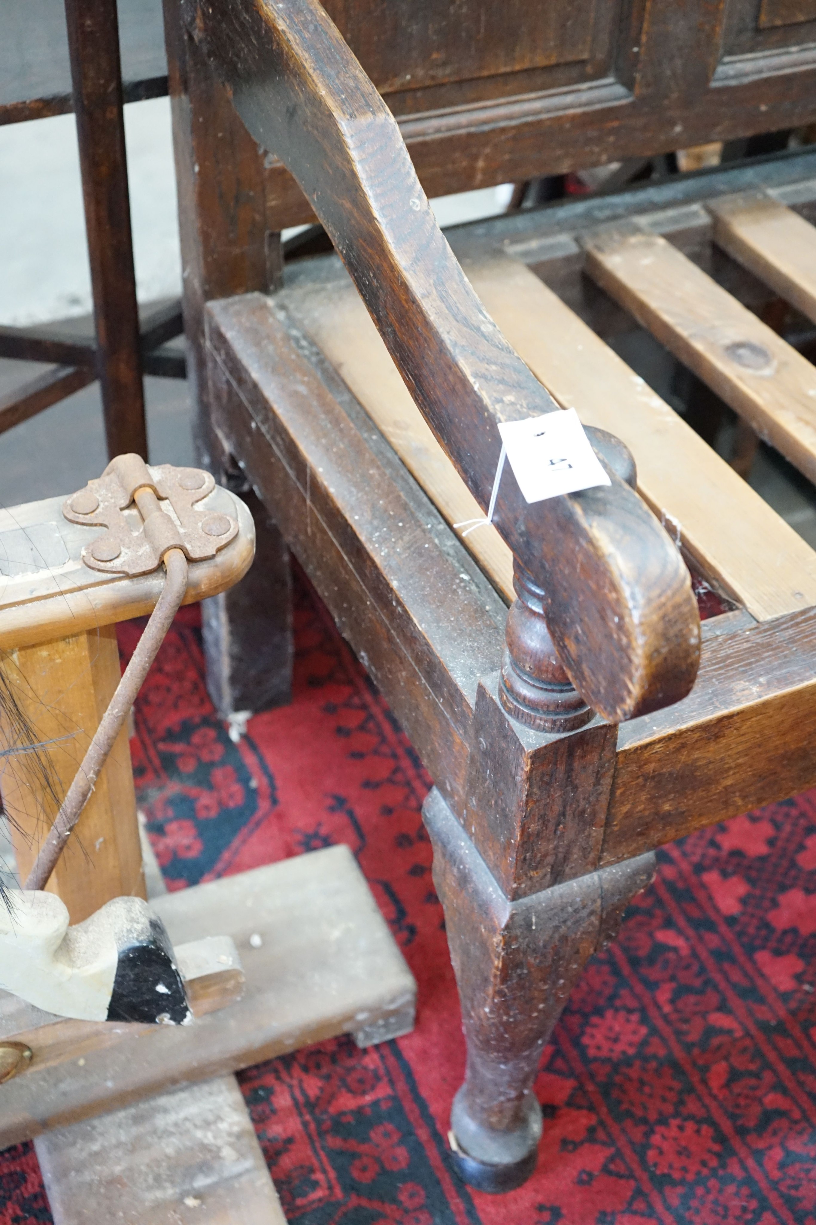 A George III oak settle, length 148cm, depth 60cm, height 106cm